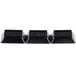 A row of black Fineline Tiny Temptations rectangular sectional trays with a white border.