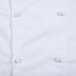 A close up of a white Mercer Culinary chef jacket.