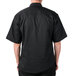 A man wearing a black Mercer Culinary chef jacket.