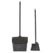 A Carlisle black broom and dustpan set with a black handle.