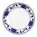 A white Thunder Group melamine plate with blue flowers on it.