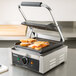 A sandwich cooking on a Galaxy panini grill.