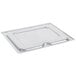 A Vollrath stainless steel tray with a lid.