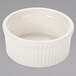 A Tuxton eggshell white fluted ramekin with a ribbed rim.