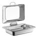 An Acopa stainless steel chafing dish with a glass lid on a silver tray.