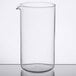 A clear Libbey glass beaker on a table.