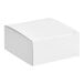 A 2 1/2" x 2 1/2" white candy box with a lid.