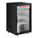 A black True countertop refrigerator with glass doors and shelves.