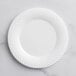 A close up of a Visions Wave white plastic plate with wavy lines.