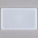 A white rectangular Flexsil lid on a gray background.