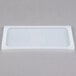 A white Flexsil high-heat silicone lid on a white rectangular food pan.