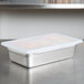 A silver Flexsil lid on a metal container.