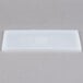 A white rectangular high-heat silicone lid on a white plastic container.