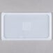 A white rectangular Flexsil lid on a white surface.