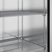 A True stainless steel reach-in refrigerator with shelves.