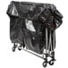 A black plastic bag on a Rubbermaid laundry cart.