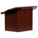 A mahogany wooden lectern on a table.