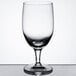 A close-up of a clear Reserve by Libbey wine glass on a white background.