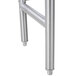 A close-up of an Advance Tabco metal leg on a Filler Table.