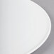 A close-up of a Libbey Aluma White porcelain round tray.