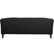 A Flash Furniture black leather sofa with wooden legs.