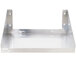 A close-up of a silver stainless steel Advance Tabco microwave shelf with two holes.