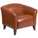 A Flash Furniture brown leather chair with wooden legs.