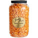 A jar of Grandma Jack's Gourmet Bacon Cheddar Popcorn with a black lid.