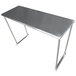 A silver stainless steel table mounted overshelving unit on a long rectangular metal table.