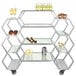 An Eastern Tabletop stainless steel rolling buffet with clear acrylic shelves holding drinks.