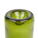 A close up of a green Arcoroc wine bottle tumbler.