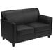 A black Flash Furniture Hercules Diplomat loveseat with wooden legs.