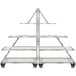 A silver metal Eastern Tabletop rolling buffet cart with clear tempered glass shelves.