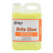 A white container of yellow Noble Chemical Brite Glow laundry emulsion.