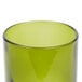 An Arcoroc green wine bottle tumbler with a black rim.