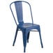 a blue metal chair with a white background