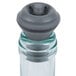 A Vacu Vin wine saver vacuum pump with black stoppers.
