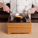 a chef cooking food in a pan