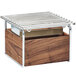 A wooden box with metal racks inside on a table.