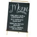 a menu sign with white writing