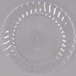 A Fineline clear plastic plate with a wavy edge.