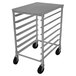 A stainless steel metal rack with black wheels.