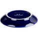 A cobalt blue Tuxton cappuccino saucer with a white rim.