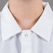 A person wearing a white Chef Revival cook shirt.