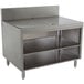 A stainless steel Advance Tabco drainboard cabinet with a shelf on it.