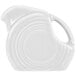 A white pitcher with a handle.