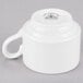 A Homer Laughlin Pristine Ameriwhite china tea cup with a handle.