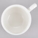 A Homer Laughlin bright white china tea cup with a handle.