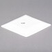 A white square CAC porcelain plate.