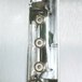 The metal door of a Traulsen single section heated holding cabinet with four metal buttons.